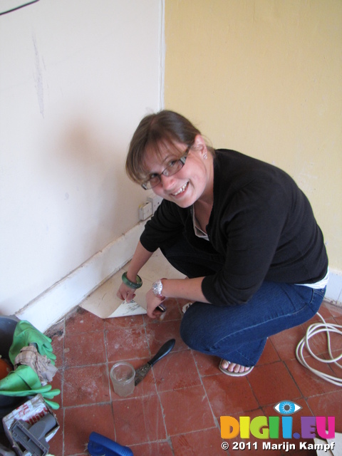 SX19976 Jenni lifting off last easy tiles of kitchen floor